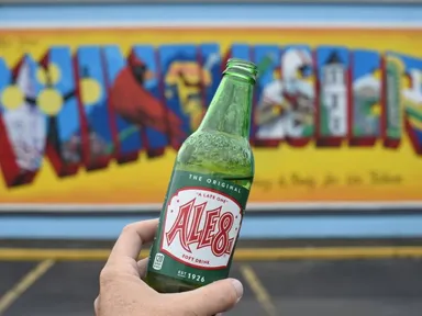 Bottle of Ale 8 in front of Winchester mural